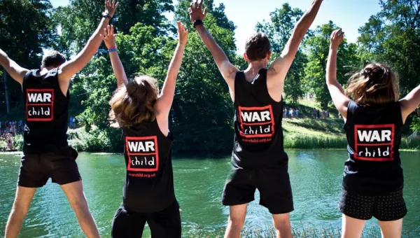 People wearing War Child branded vests.