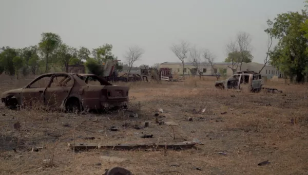 Two destroyed cars in South Sudan.
