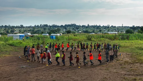 Children outside in a circle playing