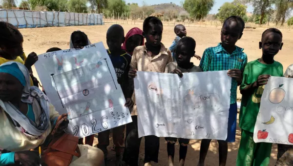 Children holding up posters.