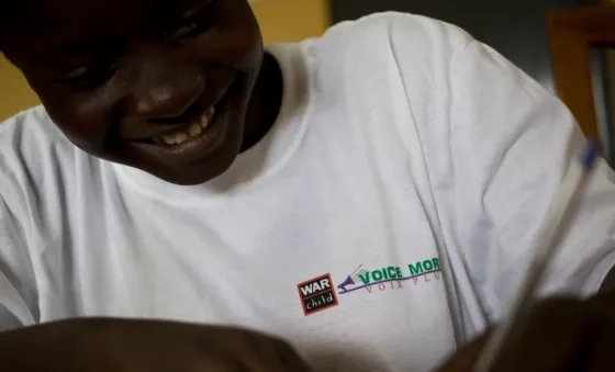 VoiceMore participant smiling in project meeting.
