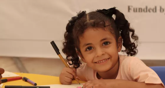 Nuraan in a temporary classroom at a refugee camp in Yemen. 