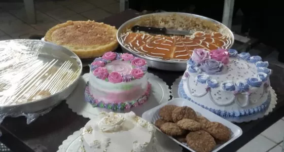 A table covered in various dishes made by people in Yemen.