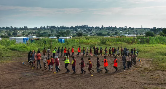 Children outside in a circle playing