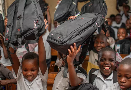 Children in DRC with their education packs