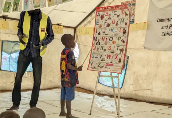 Child learning the alphabet in South Sudan