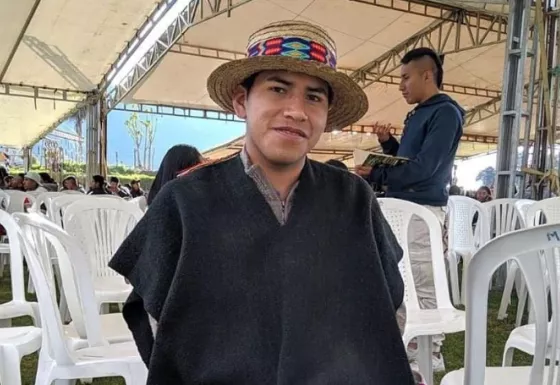 Staff member wearing a colourful hat