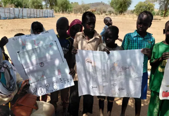 Children holding up posters.