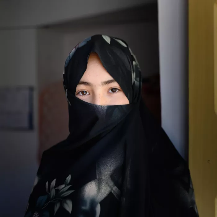 15 year old teen wearing a black hijab covering her nose and mouth
